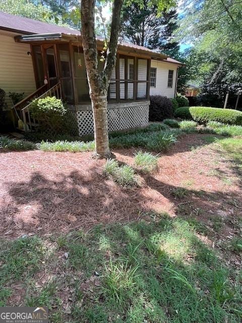 304 Tunis Rd, Mcdonough, GA 30253 - view of front facade featuring a sunroom