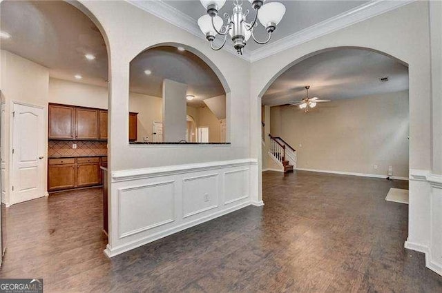 2280 Copper Trail Ln, Buford, GA 30519 - unfurnished dining area with crown molding, stairway, a ceiling fan, dark wood-style floors, and a chandelier