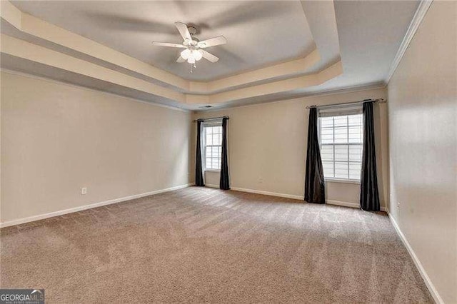 2280 Copper Trail Ln, Buford, GA 30519 - empty room with ceiling fan, carpet, a tray ceiling, baseboards, and ornamental molding