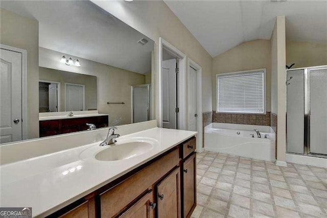 2280 Copper Trail Ln, Buford, GA 30519 - bathroom featuring a shower stall, lofted ceiling, vanity, and a bath