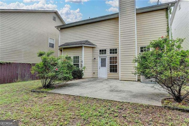 2280 Copper Trail Ln, Buford, GA 30519 - rear view of property featuring a patio and a chimney