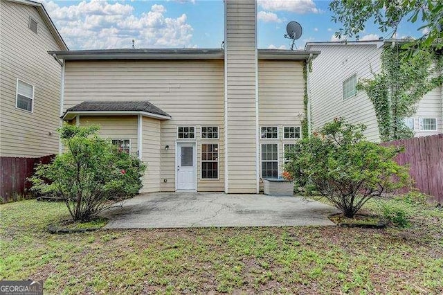 2280 Copper Trail Ln, Buford, GA 30519 - rear view of property featuring a patio area and a chimney