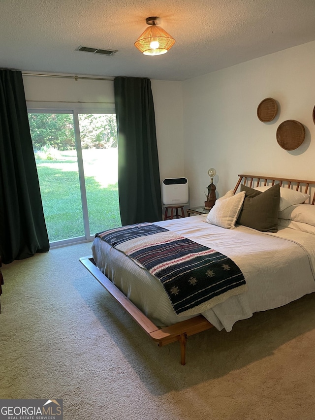 211 Groveland Dr, Peachtree City, GA 30269 - carpeted bedroom with a textured ceiling and access to outside