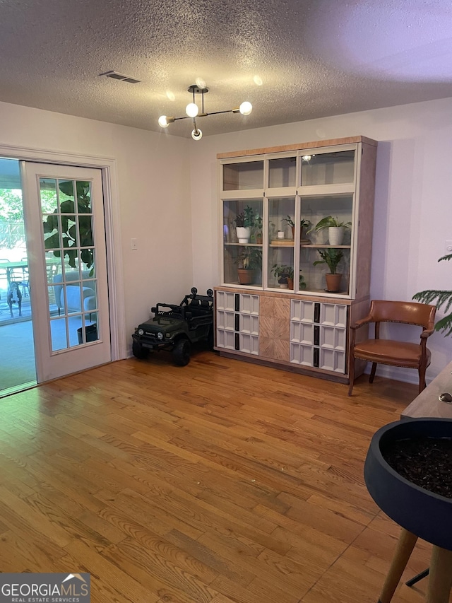 211 Groveland Dr, Peachtree City, GA 30269 - sitting room featuring wood finished floors and a textured ceiling