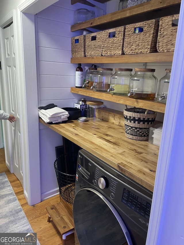 211 Groveland Dr, Peachtree City, GA 30269 - laundry room featuring washer / dryer and wood finished floors
