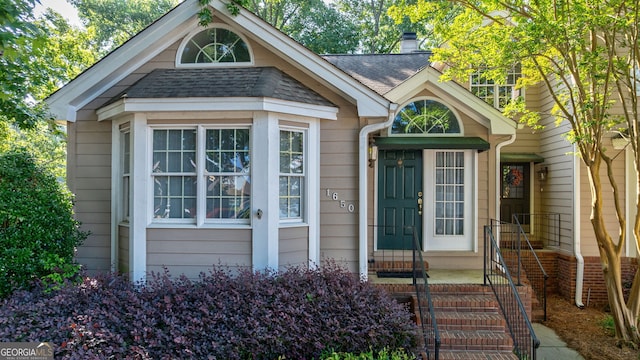 1650 Vintage Club Dr, Greensboro, GA 30642 - view of front facade featuring a chimney and a shingled roof