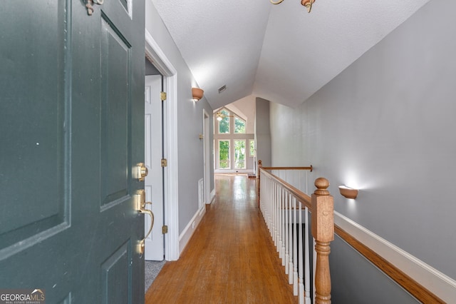 1650 Vintage Club Dr, Greensboro, GA 30642 - entrance foyer with wood finished floors, baseboards, and vaulted ceiling