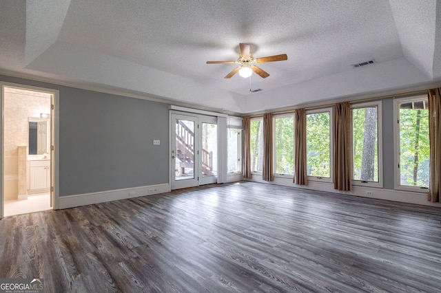 1650 Vintage Club Dr, Greensboro, GA 30642 - spare room with a raised ceiling, a textured ceiling, ceiling fan, dark wood-style floors, and baseboards