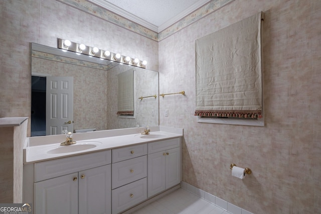 1650 Vintage Club Dr, Greensboro, GA 30642 - full bathroom featuring double vanity, wallpapered walls, tile patterned flooring, crown molding, and baseboards