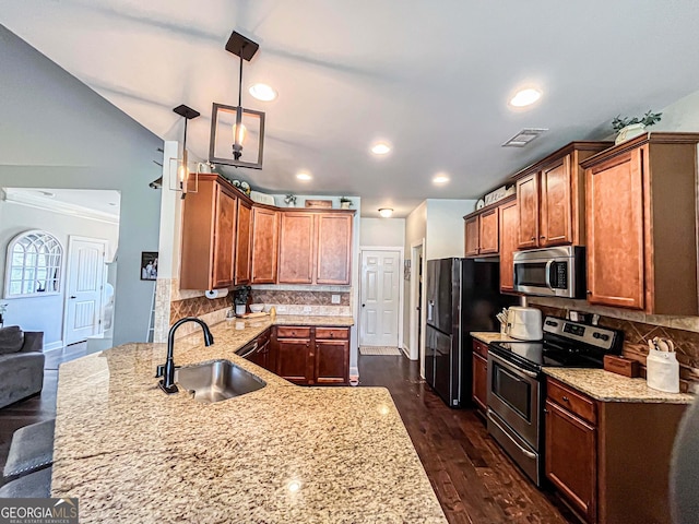 125 Kayla Ct, Locust Grove, GA 30248 - kitchen featuring stainless steel appliances, a sink, light stone countertops, tasteful backsplash, and pendant lighting