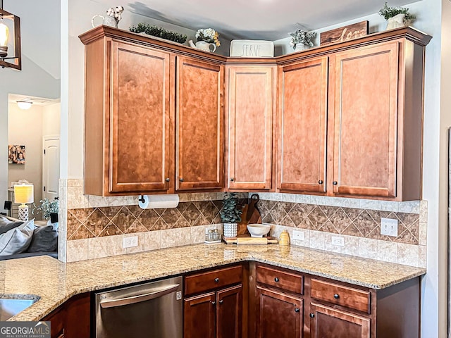 125 Kayla Ct, Locust Grove, GA 30248 - kitchen with stainless steel dishwasher, light stone countertops, and backsplash