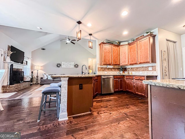 125 Kayla Ct, Locust Grove, GA 30248 - kitchen featuring dishwasher, a peninsula, open floor plan, dark wood-type flooring, and a ceiling fan