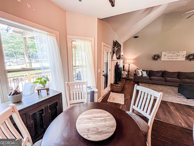 125 Kayla Ct, Locust Grove, GA 30248 - dining space with wood finished floors, plenty of natural light, and vaulted ceiling