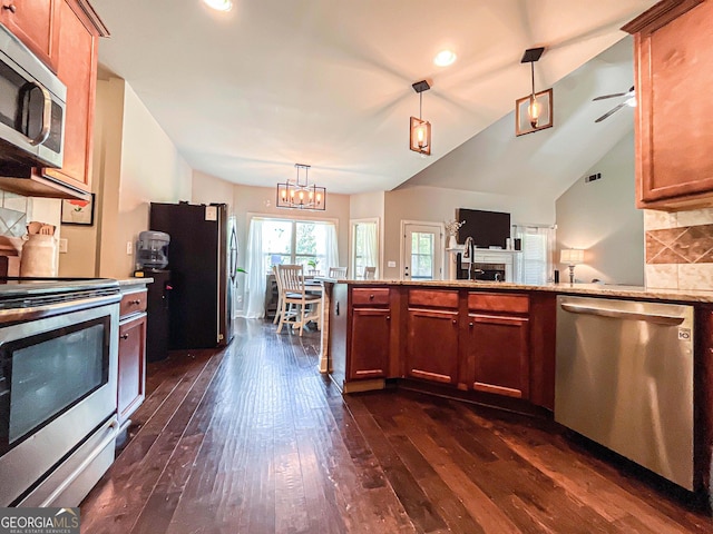 125 Kayla Ct, Locust Grove, GA 30248 - kitchen with stainless steel appliances, dark wood finished floors, decorative backsplash, pendant lighting, and recessed lighting