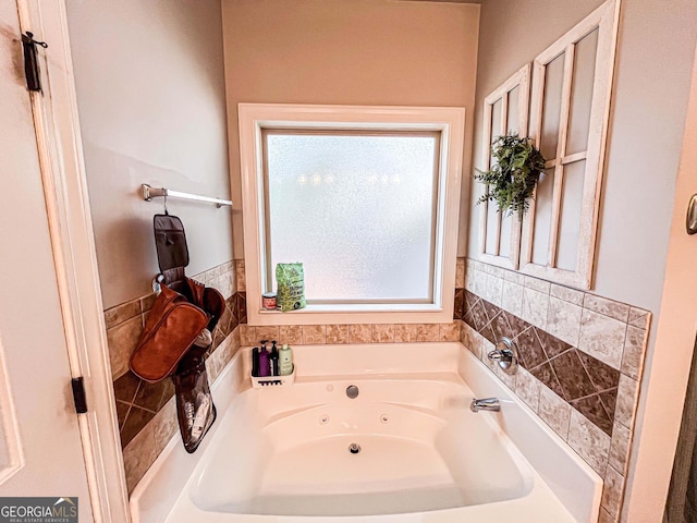 125 Kayla Ct, Locust Grove, GA 30248 - bathroom featuring a whirlpool tub and plenty of natural light