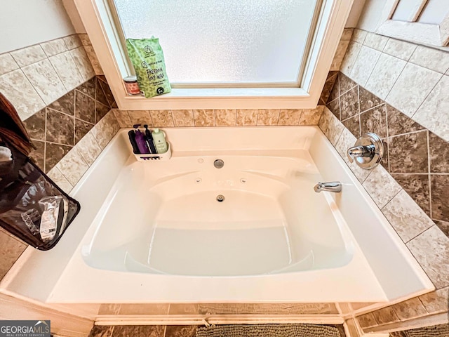 125 Kayla Ct, Locust Grove, GA 30248 - full bath with a whirlpool tub and plenty of natural light