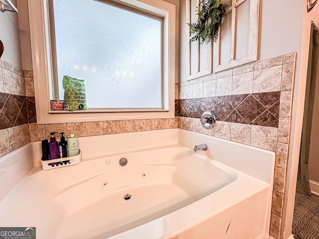 125 Kayla Ct, Locust Grove, GA 30248 - bathroom featuring a tub with jets