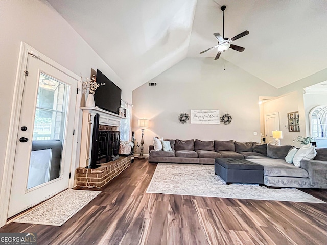 125 Kayla Ct, Locust Grove, GA 30248 - living room featuring a ceiling fan, dark wood finished floors, a brick fireplace, and high vaulted ceiling