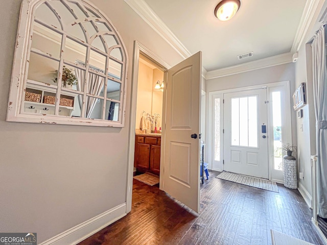 125 Kayla Ct, Locust Grove, GA 30248 - foyer with dark wood finished floors, ornamental molding, and baseboards