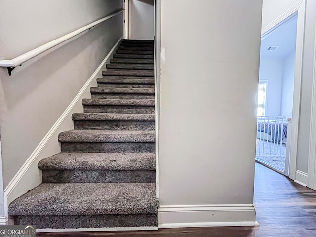 125 Kayla Ct, Locust Grove, GA 30248 - stairway with wood finished floors and baseboards
