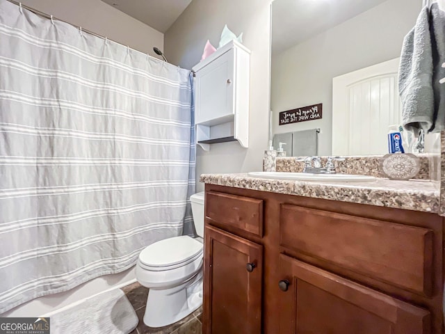 125 Kayla Ct, Locust Grove, GA 30248 - bathroom with toilet, vanity, and a shower with shower curtain