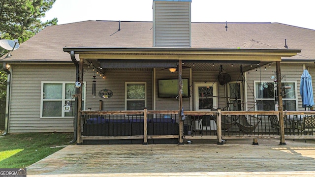 125 Kayla Ct, Locust Grove, GA 30248 - rear view of property featuring a deck and a chimney