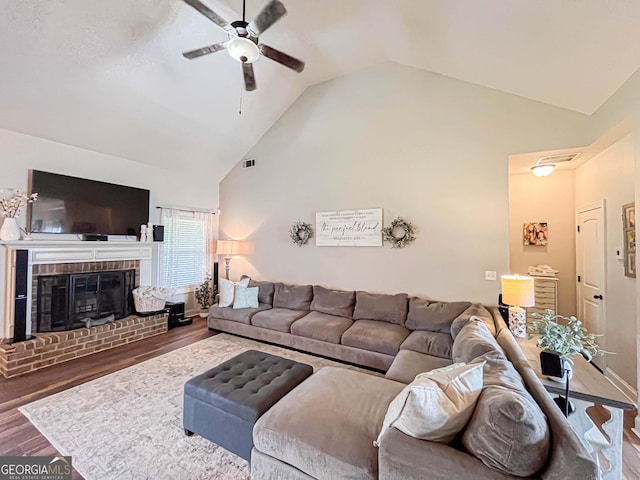 125 Kayla Ct, Locust Grove, GA 30248 - living room featuring ceiling fan, wood finished floors, a fireplace, and high vaulted ceiling
