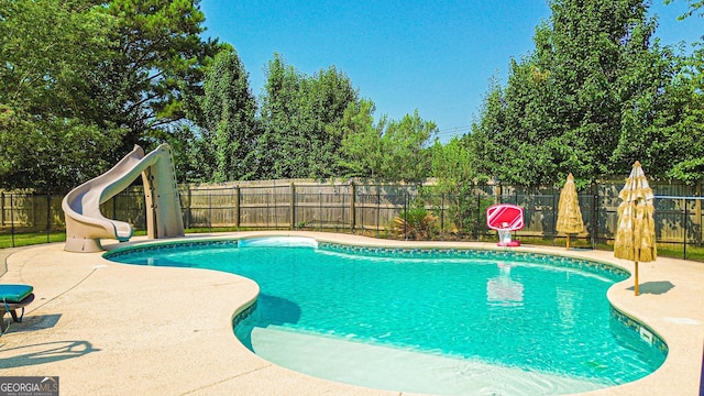 125 Kayla Ct, Locust Grove, GA 30248 - view of pool featuring a water slide, a fenced backyard, and a patio