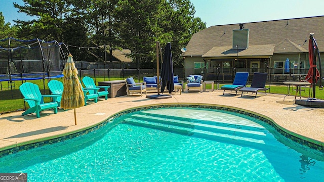 125 Kayla Ct, Locust Grove, GA 30248 - view of pool featuring a trampoline and a patio