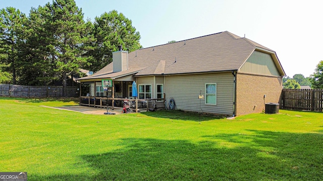 125 Kayla Ct, Locust Grove, GA 30248 - back of property featuring a patio, brick siding, a chimney, and central air condition unit