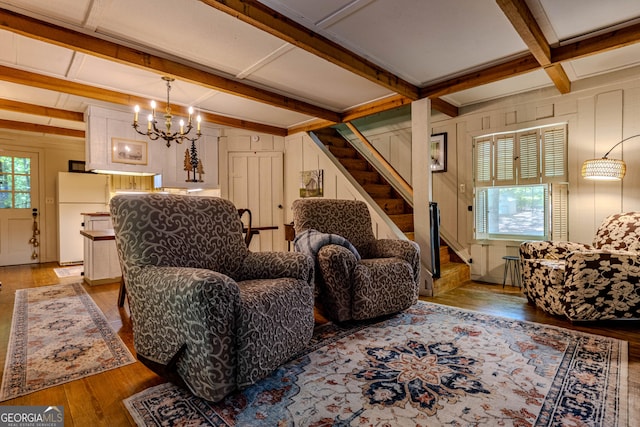 196 Elm St, Menlo, GA 30731 - living room featuring stairway, coffered ceiling, wood finished floors, beam ceiling, and a chandelier