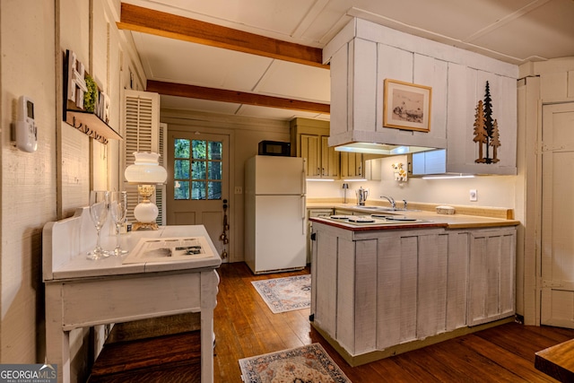 196 Elm St, Menlo, GA 30731 - kitchen featuring white appliances, dark wood finished floors, a peninsula, and beam ceiling