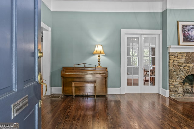 3119 Conyers St SE, Covington, GA 30014 - entrance foyer with wood finished floors, baseboards, and a stone fireplace