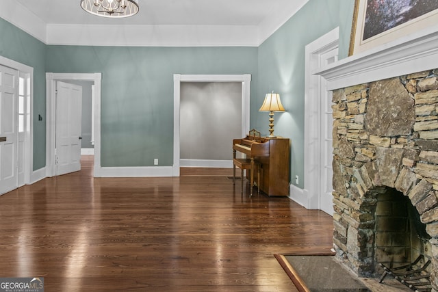 3119 Conyers St SE, Covington, GA 30014 - living room with hardwood / wood-style flooring, a chandelier, and baseboards