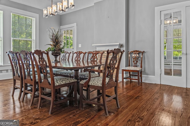 3119 Conyers St SE, Covington, GA 30014 - dining area featuring a chandelier and wood finished floors