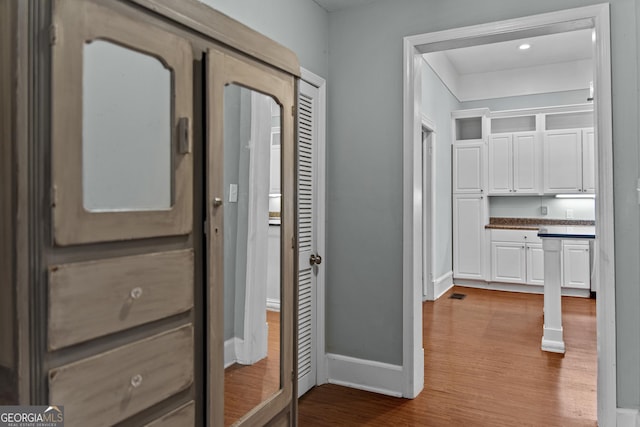 3119 Conyers St SE, Covington, GA 30014 - hall featuring wood finished floors and baseboards
