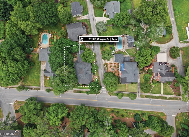 3119 Conyers St SE, Covington, GA 30014 - aerial view of property and surrounding area featuring property boundaries highlighted and nearby suburban area