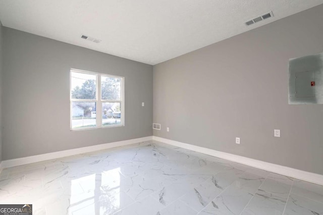 8500 Bowen Ct, Jonesboro, GA 30238 - unfurnished room featuring electric panel, baseboards, and marble finish floors