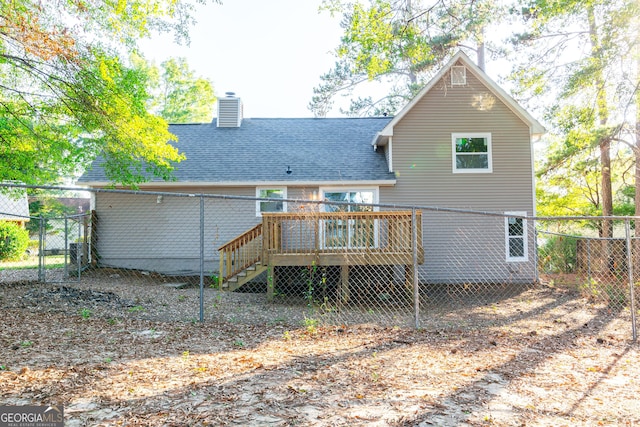 8500 Bowen Ct, Jonesboro, GA 30238 - rear view of house with a wooden deck, a chimney, and a shingled roof