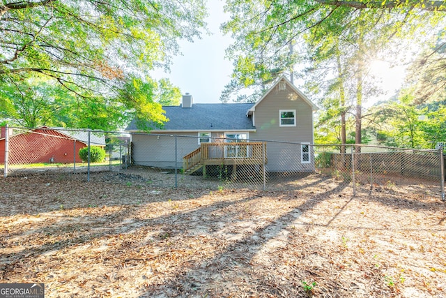 8500 Bowen Ct, Jonesboro, GA 30238 - rear view of property featuring a deck, stairs, and a chimney