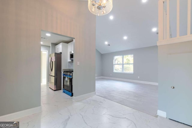 8500 Bowen Ct, Jonesboro, GA 30238 - unfurnished living room with baseboards, light marble finish floors, a towering ceiling, recessed lighting, and a chandelier