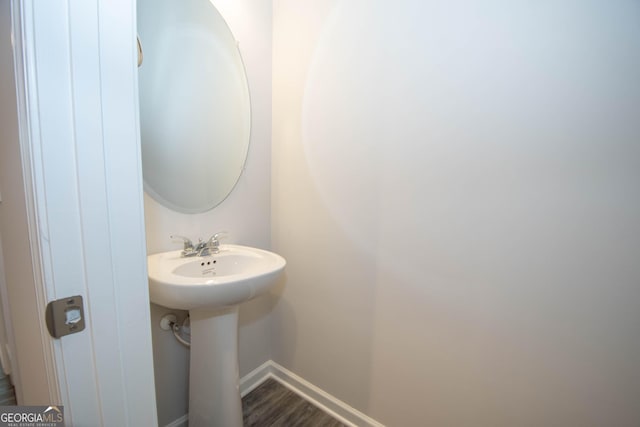 26 Sepia Oak Dr, Newnan, GA 30263 - bathroom featuring baseboards, a sink, and wood finished floors