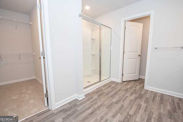 26 Sepia Oak Dr, Newnan, GA 30263 - full bathroom featuring a shower stall, wood finished floors, baseboards, and recessed lighting