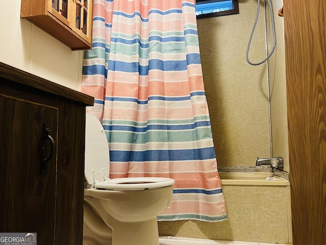 218 Helen Rd, Covington, GA 30016 - bathroom featuring toilet and shower / bathtub combination with curtain