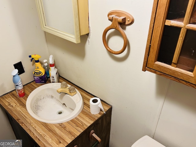 218 Helen Rd, Covington, GA 30016 - half bathroom with vanity and toilet
