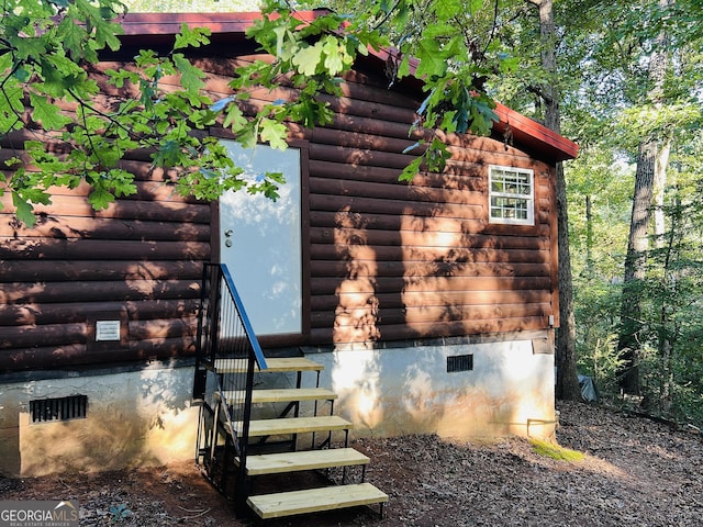 218 Helen Rd, Covington, GA 30016 - view of side of home featuring crawl space and log siding