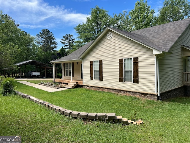3725 Concord Rd, Newborn, GA 30056 - back of property featuring a carport, a shingled roof, and a lawn