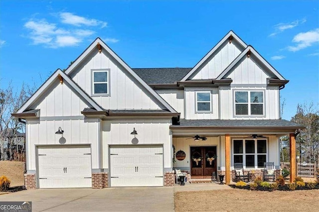 14 Brownwood Dr SE, Cartersville, GA 30120 - view of front of home featuring a garage, a porch, board and batten siding, roof with shingles, and driveway