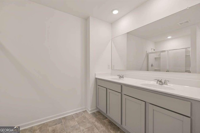 11884 Aukerman Way, Hampton, GA 30228 - bathroom with double vanity, baseboards, and a stall shower