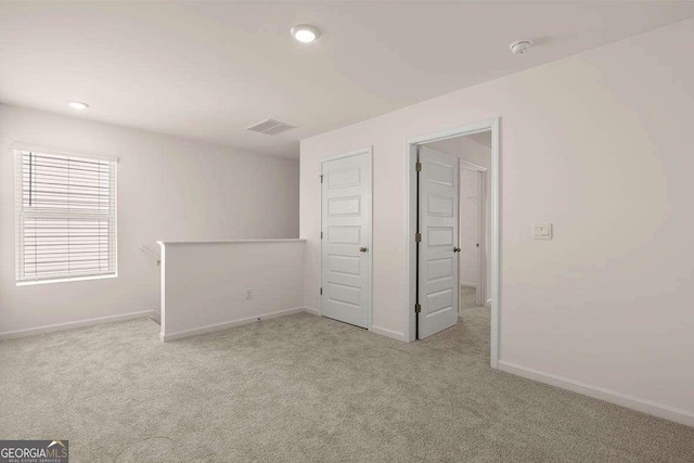 11884 Aukerman Way, Hampton, GA 30228 - unfurnished bedroom with light colored carpet, baseboards, and recessed lighting